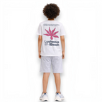 victor and jane boys white graphic t-shirt with pink floral design and text on the back, worn with grey shorts
