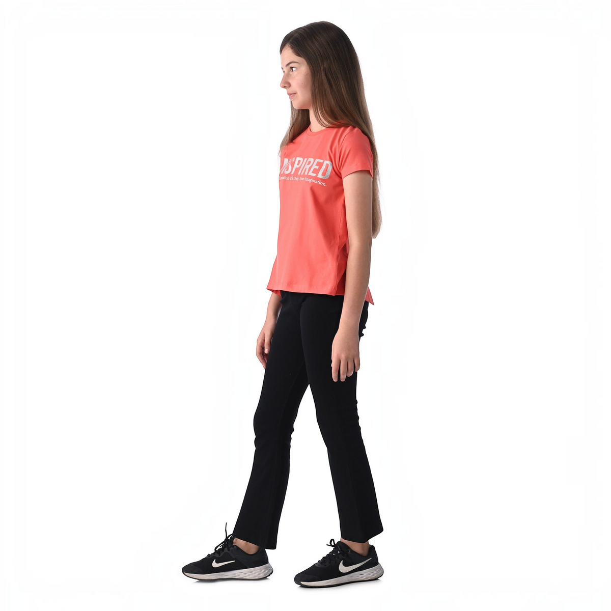 victor and jane 2-piece set featuring a coral graphic t-shirt with Inspired text and black trousers on a girl