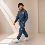 victor and jane boys blue fleece half zip sweatshirt and jogger set with white graphic text worn by a young boy