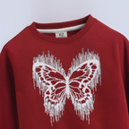 victor and jane girls red sweatshirt featuring a white butterfly graphic with a distressed fringe effect
