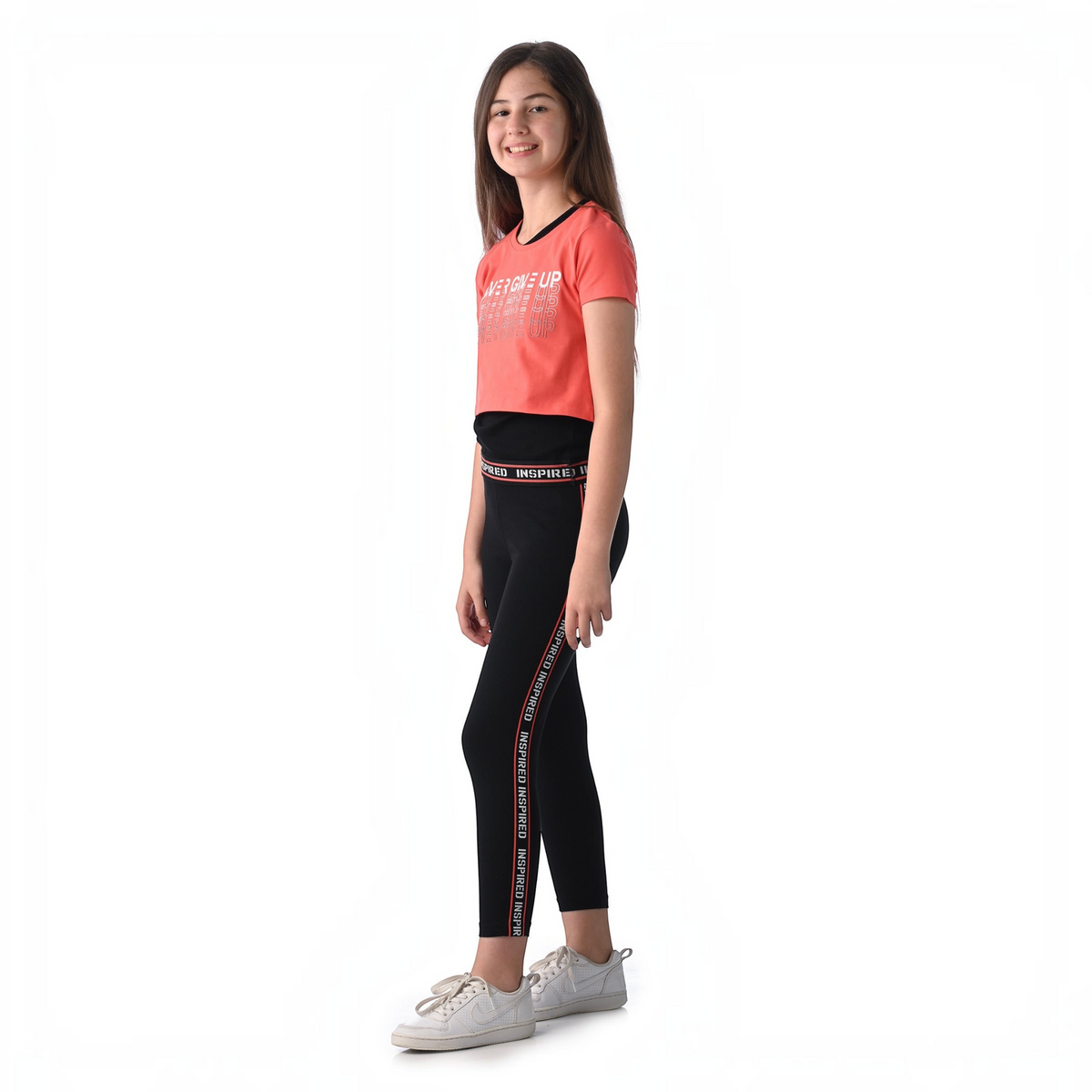 victor and jane girl wearing a coral graphic t-shirt and black leggings with side stripe detail