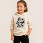Young girl wearing a cream victor and jane Girls Hoodie EURA with a black leopard print live laugh love graphic