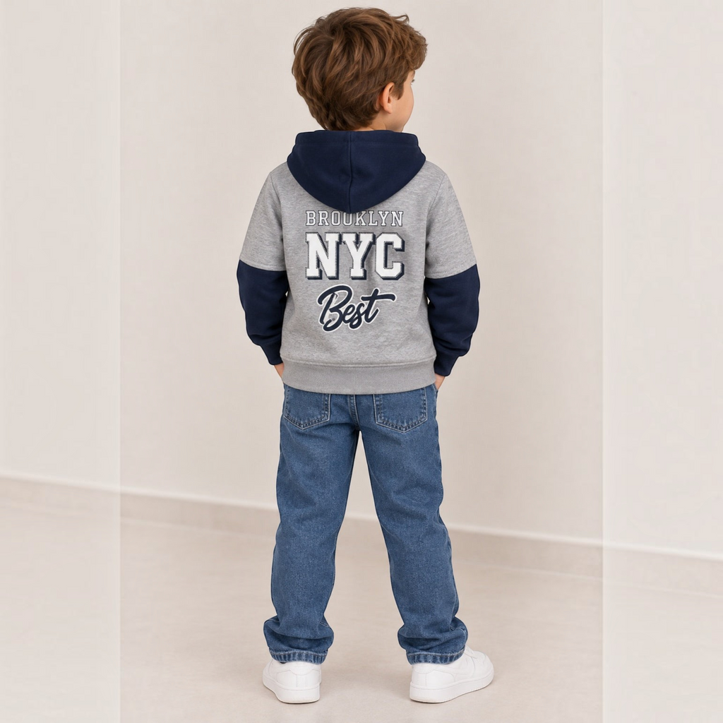 victor and jane grey and navy varsity hoodie with Brooklyn NYC graphic on back worn by a boy in blue jeans