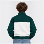 Back view of a boy wearing a victor and jane forest green and white half zip fleece pullover with ribbed cuffs