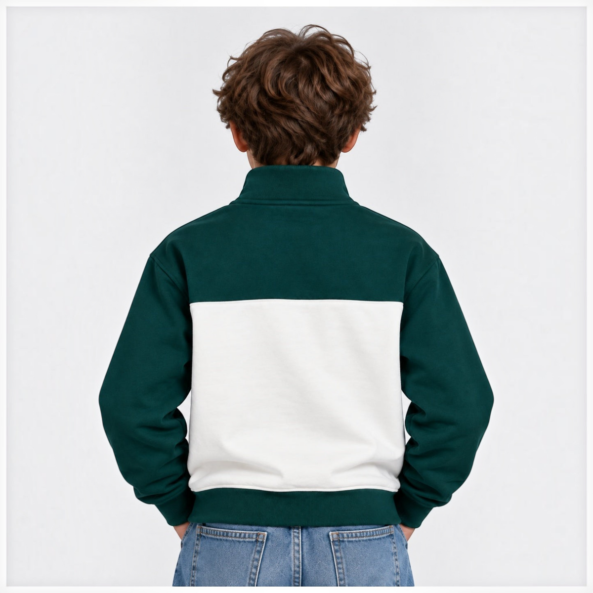 Back view of a boy wearing a victor and jane forest green and white half zip fleece pullover with ribbed cuffs