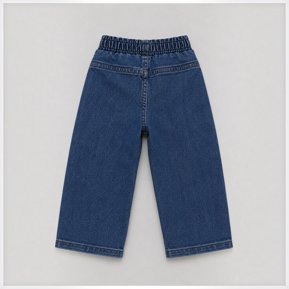 Back view of victor and jane boys denim pants with an elasticated waistband in a classic dark blue wash.