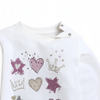 victor and jane white long-sleeve baby shirt with purple heart, star, and crown glitter print and shoulder snaps