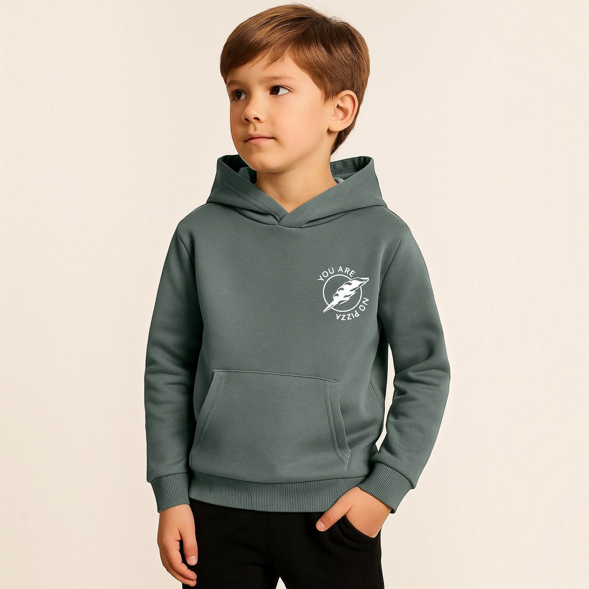 Young boy wearing a victor and jane olive green hoodie with a white circular graphic print on the chest