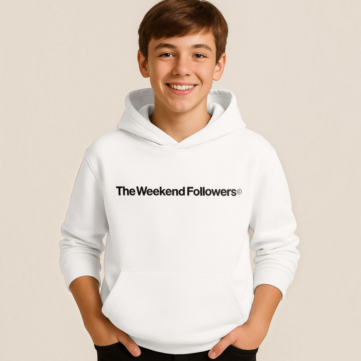 A boy wearing a white victor and jane graphic hoodie with The Weekend Followers text on the chest.
