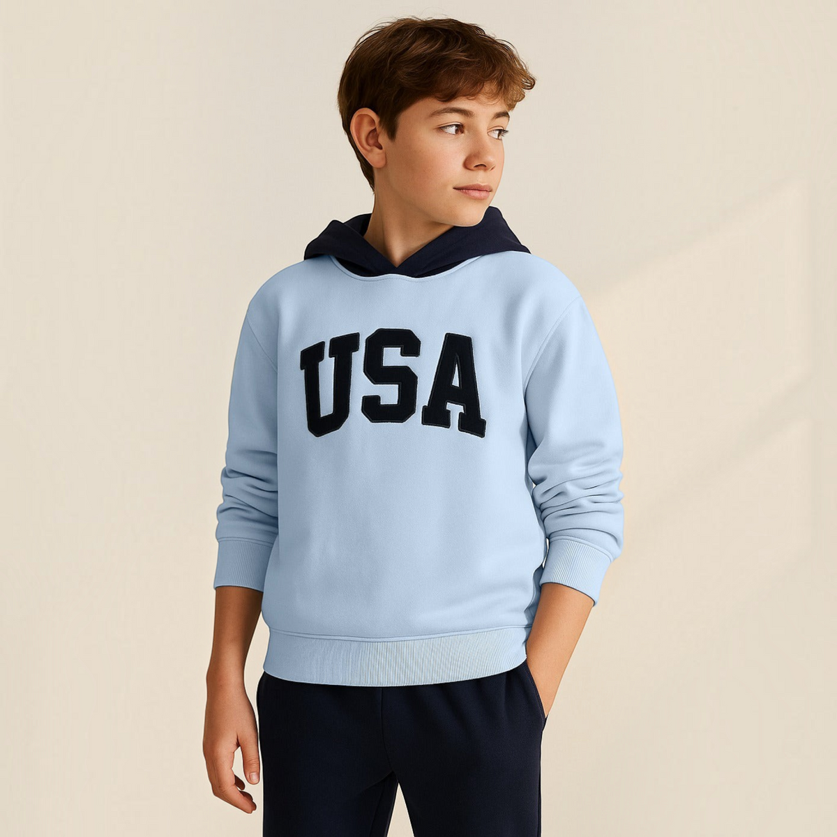 victor and jane boys light blue hoodie with navy hood and USA embroidered lettering worn by a young boy