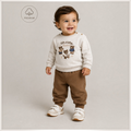 victor and jane toddler boy wearing a beige sweatshirt with bear graphics and brown jogger pants