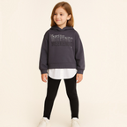 victor and jane dark grey cotton hoodie with embellished graphic text and white shirt hem worn by a young girl