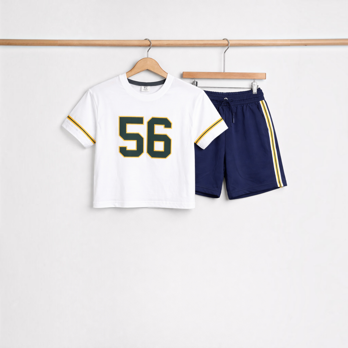victor and jane boys white t-shirt with number 56 print and navy blue athletic shorts with yellow side stripes