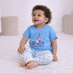 victor and jane baby boy wearing a light blue short-sleeve t-shirt with a sailboat print and striped joggers