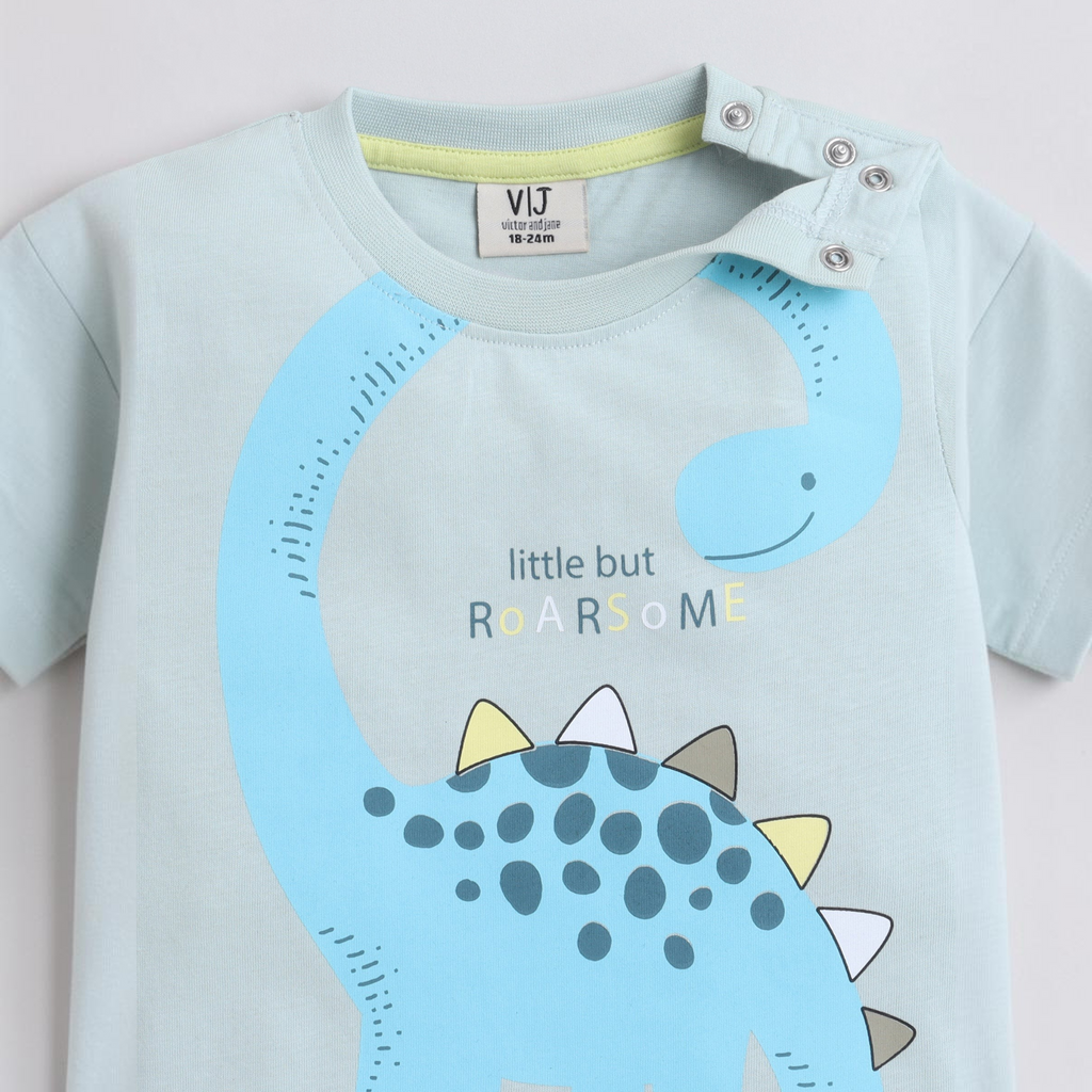 victor and jane boys light blue cotton t-shirt featuring a cute blue dinosaur graphic and shoulder snap buttons