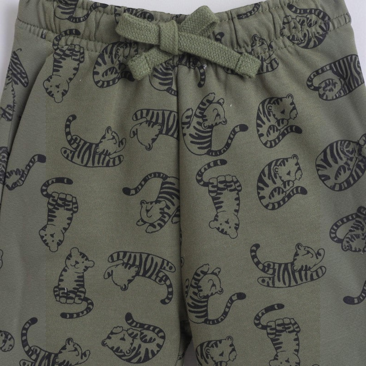 victor and jane baby boys olive green joggers featuring a black tiger print pattern and an elastic drawstring waist