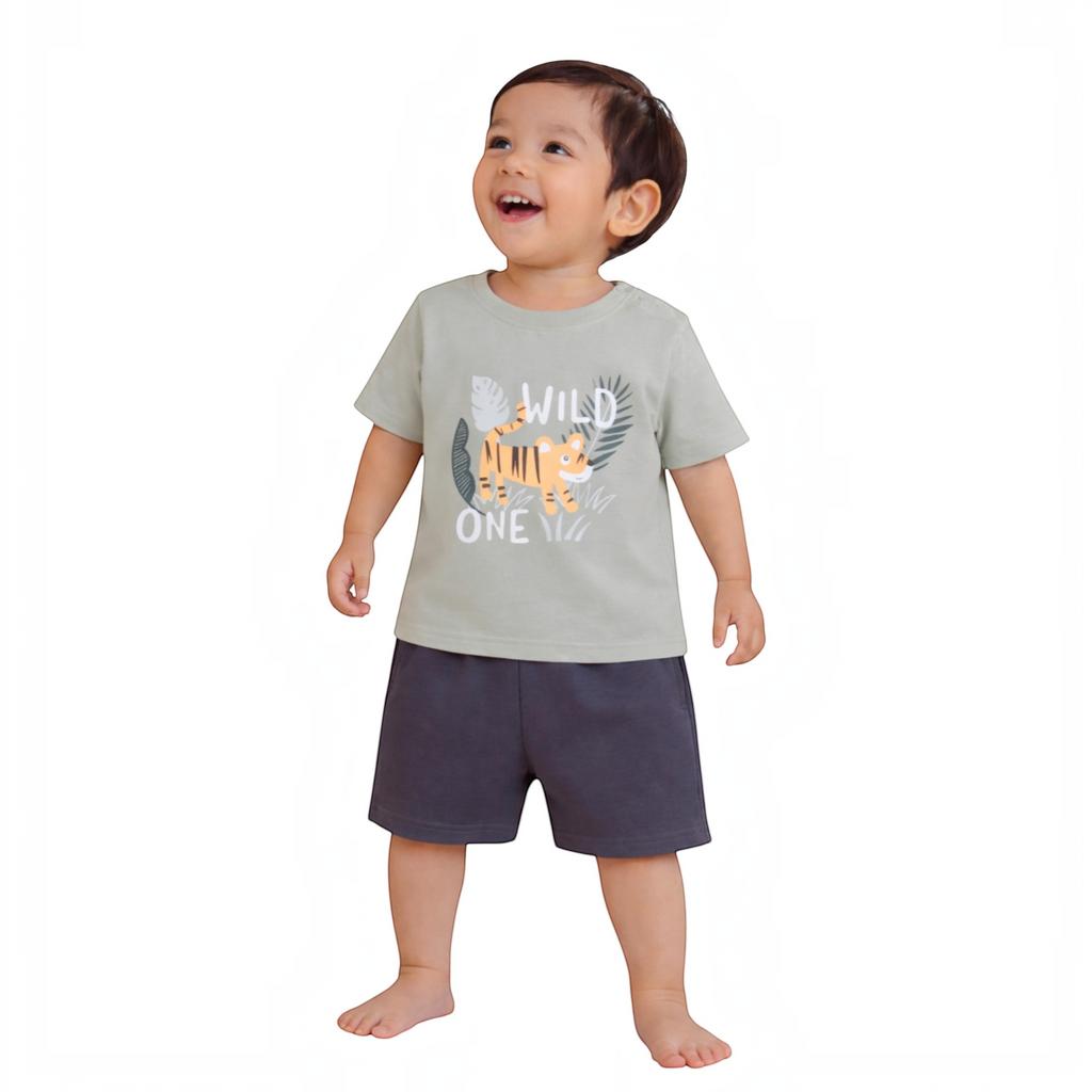 victor and jane baby boy wearing a sage green t-shirt with a tiger graphic and dark grey shorts