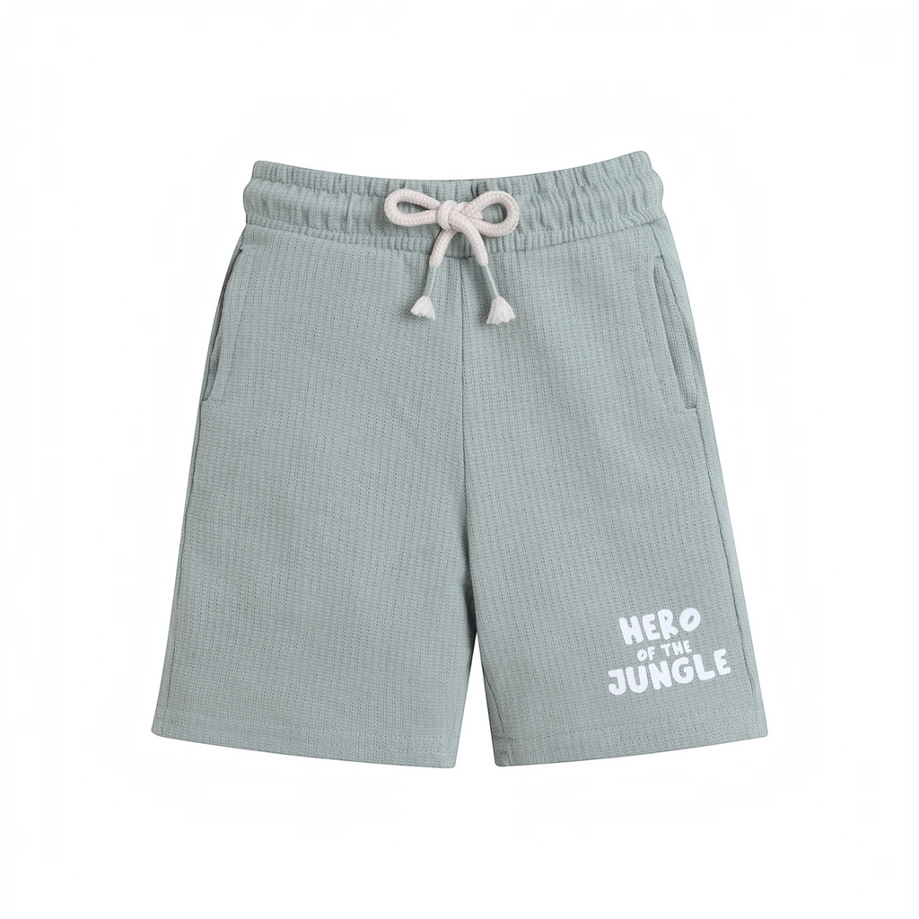 victor and jane sage green waffle knit baby boy shorts with a drawstring waist and Hero of the Jungle text print