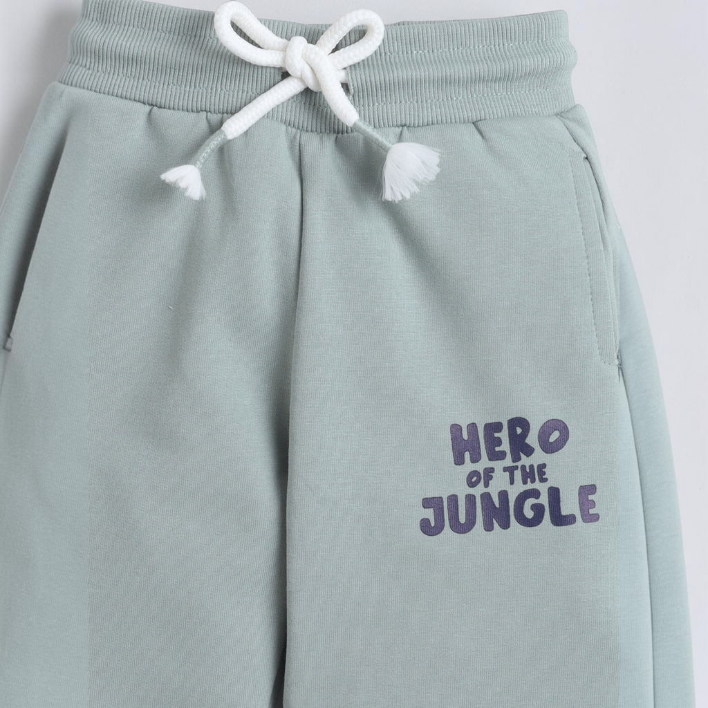 victor and jane sage green baby boys joggers with white drawstring and Hero of the Jungle graphic print