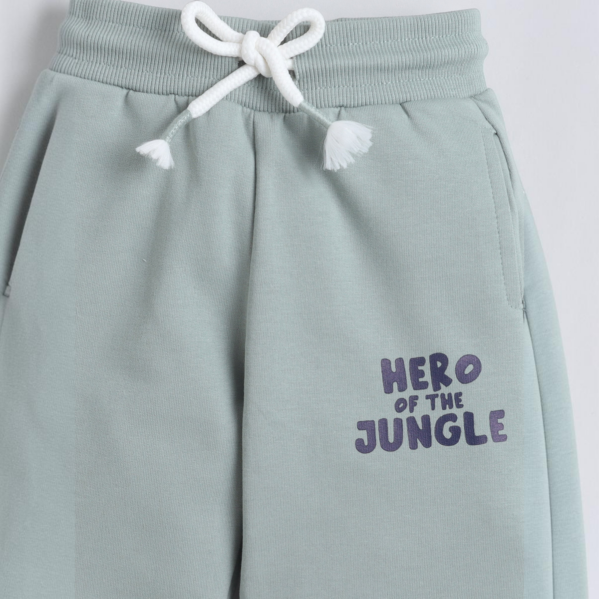 victor and jane sage green baby boys joggers with white drawstring and Hero of the Jungle graphic print