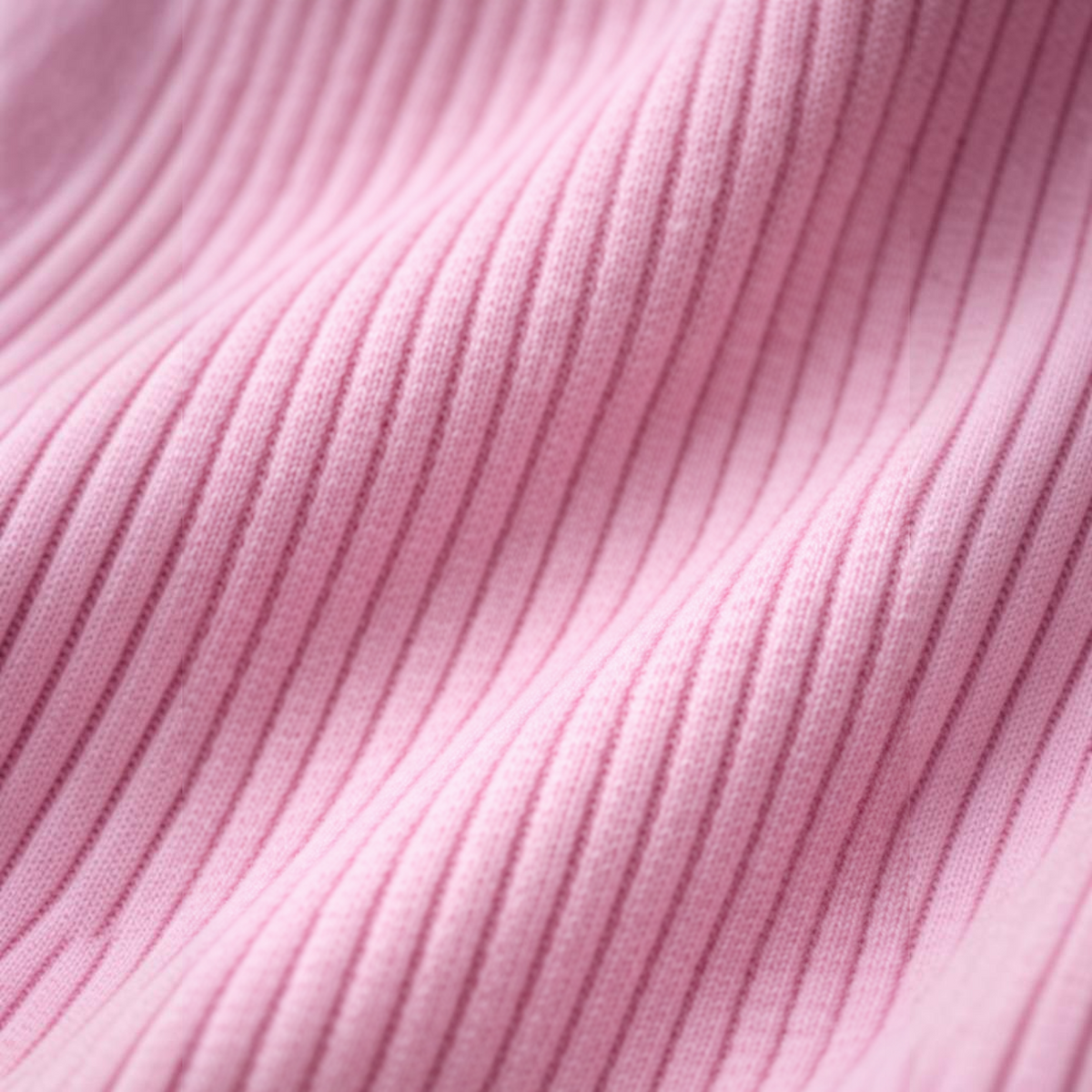 Close-up of soft pink ribbed fabric from a victor and jane baby girls bodysuit set