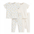 victor and jane baby girls 2pc set featuring a lemon print top and leggings alongside a solid cream ribbed outfit