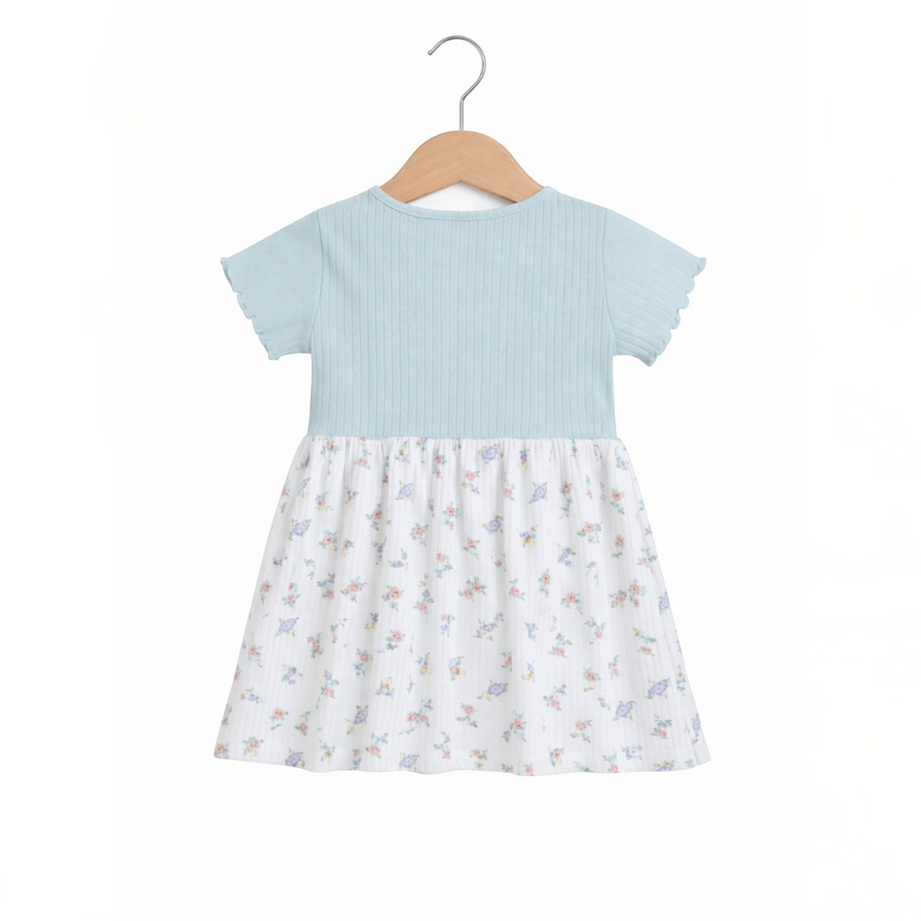 victor and jane baby girls dress with a light blue ribbed bodice and a white floral print skirt on a wooden hanger