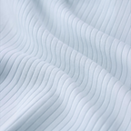 Close-up of light blue ribbed fabric from a victor and jane baby girls skirt showing soft texture and vertical lines.