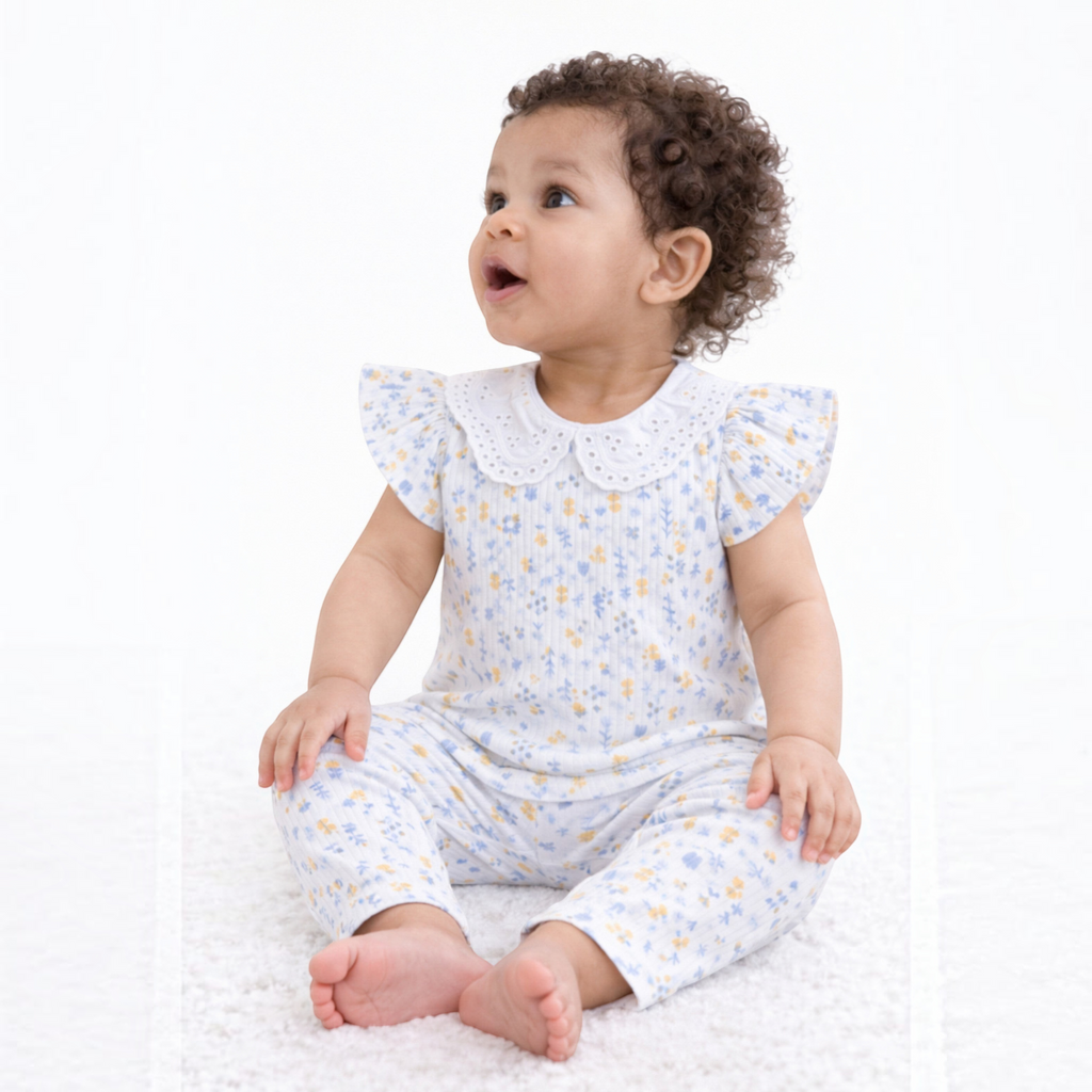 victor and jane baby girl 2-piece set featuring a floral print ribbed shirt with ruffled sleeves and matching pants