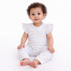 A baby girl wearing a victor and jane two-piece floral shirt set with flutter sleeves and a white eyelet collar.