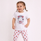 victor and jane girls 2-piece set with white graphic t-shirt and floral print leggings on a smiling toddler