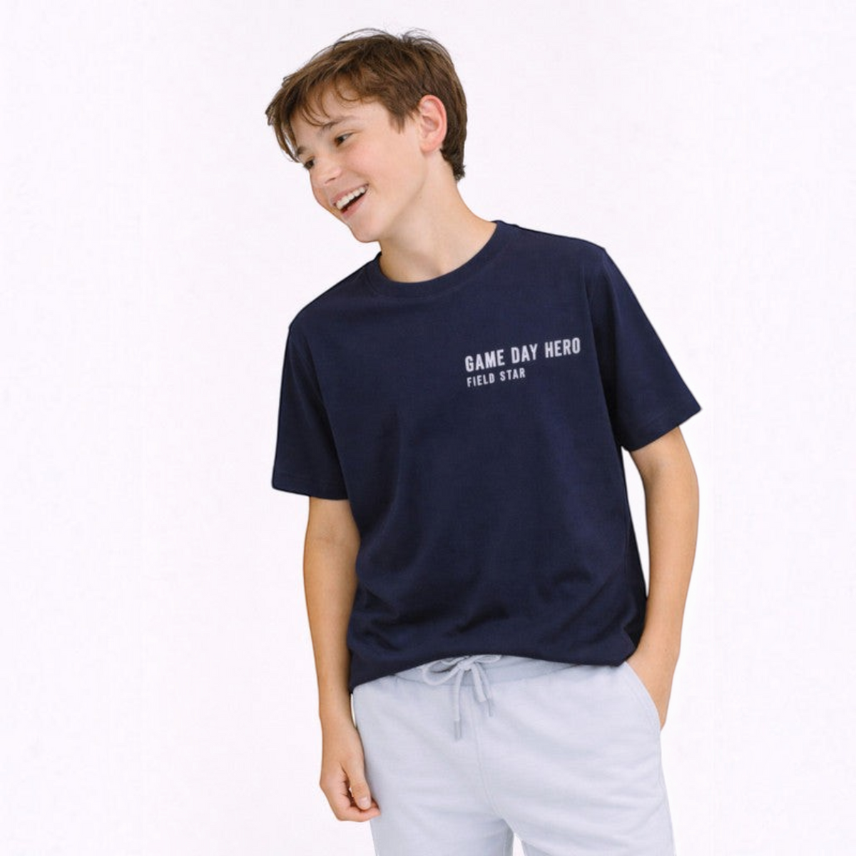 victor and jane boys navy blue graphic t-shirt with Game Day Hero text worn by a smiling boy