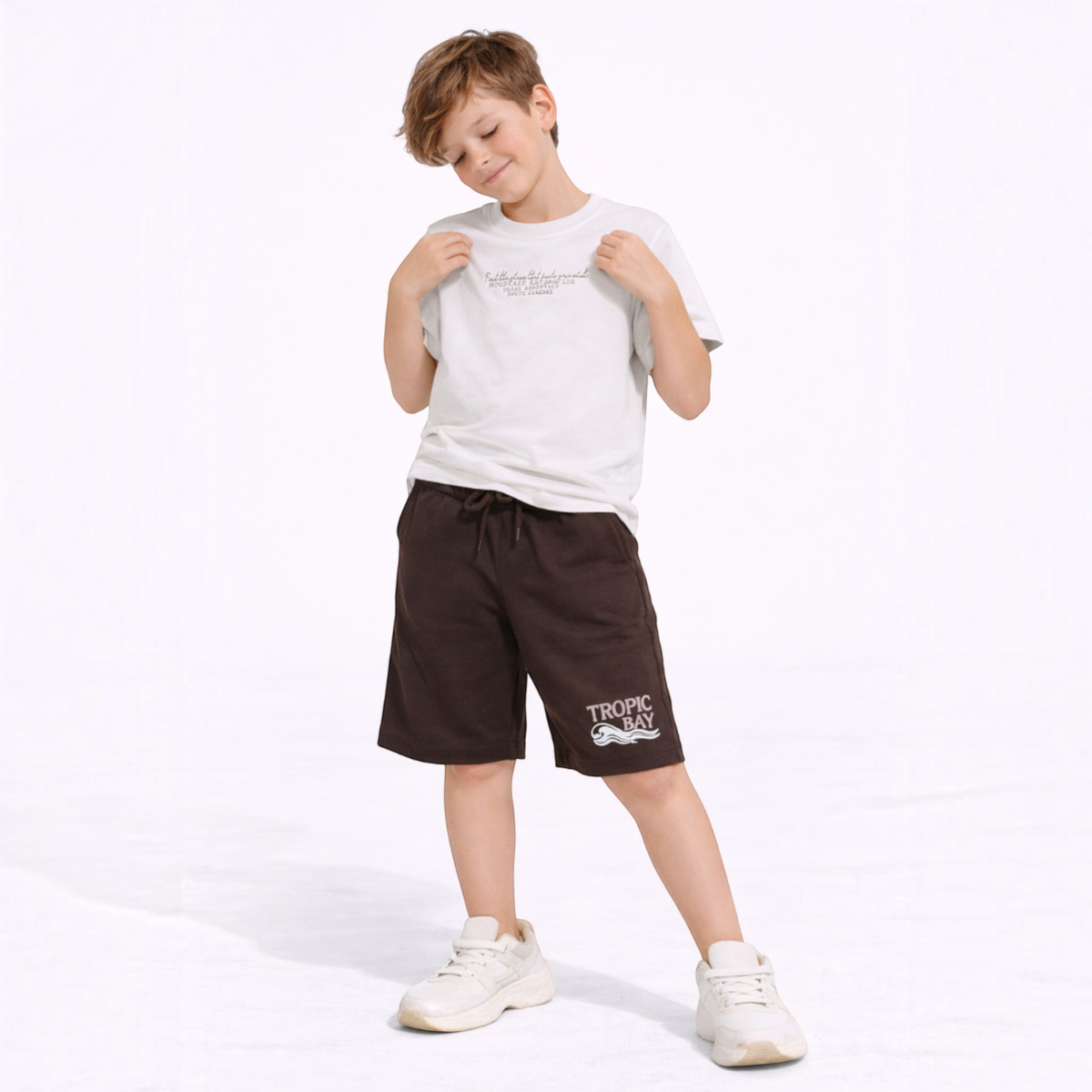 victor and jane boys graphic t-shirt and brown shorts set worn by a young boy with white sneakers