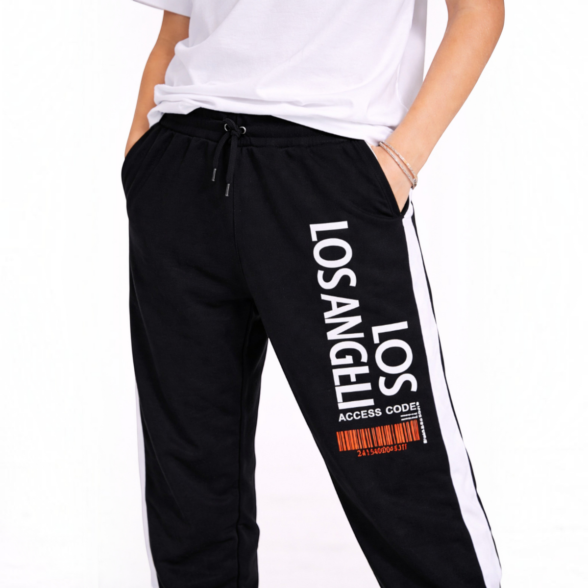 victor and jane black joggers with white side stripes and Los Angeles graphic print worn with a white t-shirt