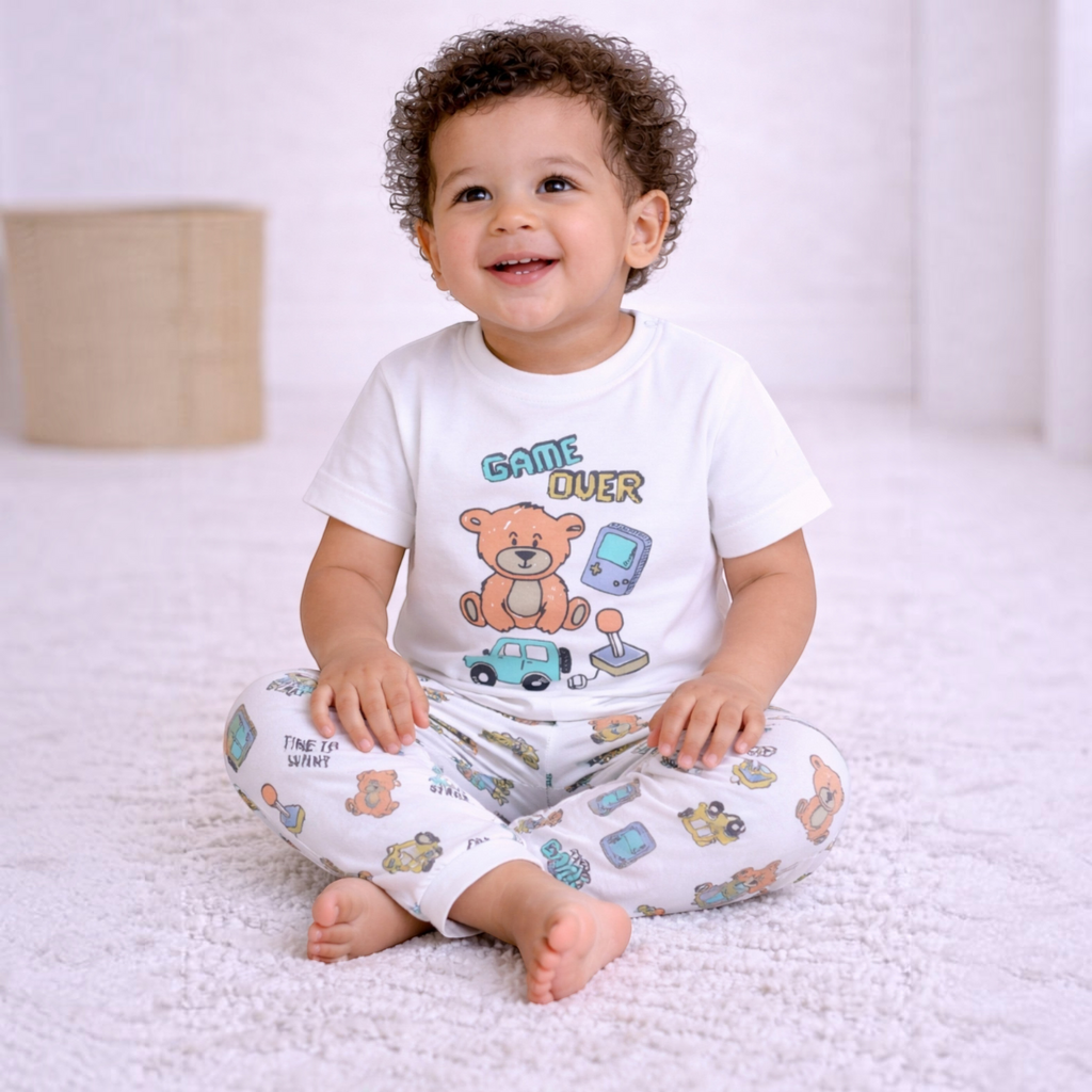 victor and jane baby boy wearing a white short-sleeve t-shirt with a playful bear and game console print