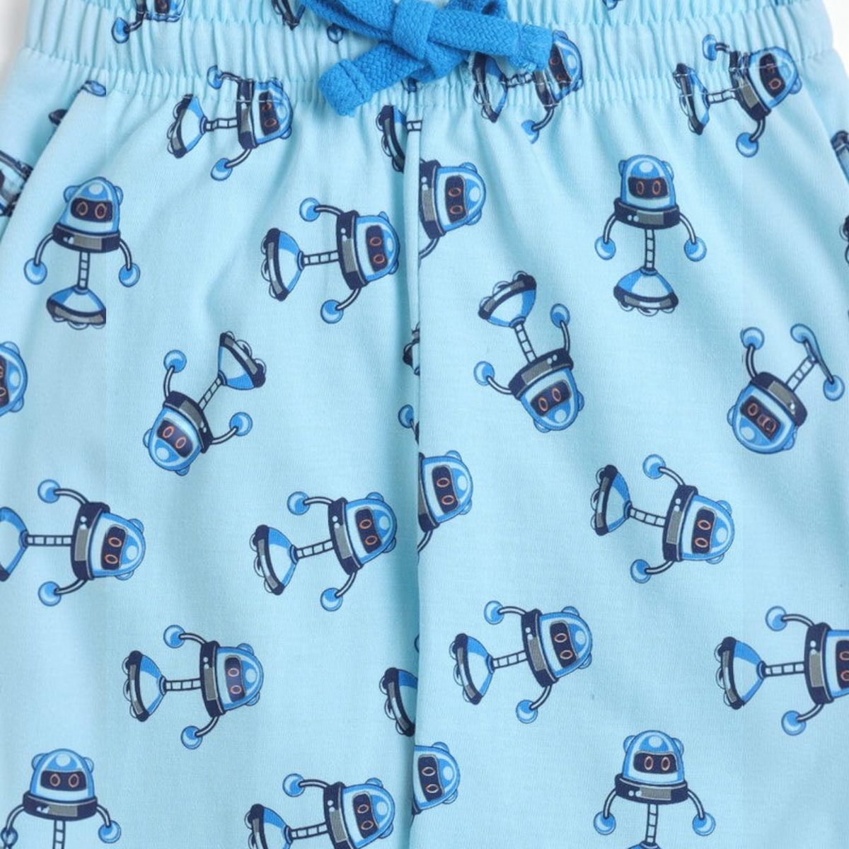 victor and jane boys light blue cotton t-shirt fabric featuring a repeating dark blue robot graphic print