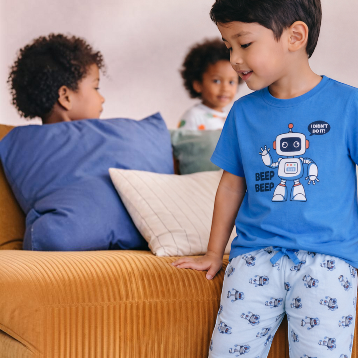victor and jane boys blue graphic t-shirt and robot print shorts set worn by a young boy