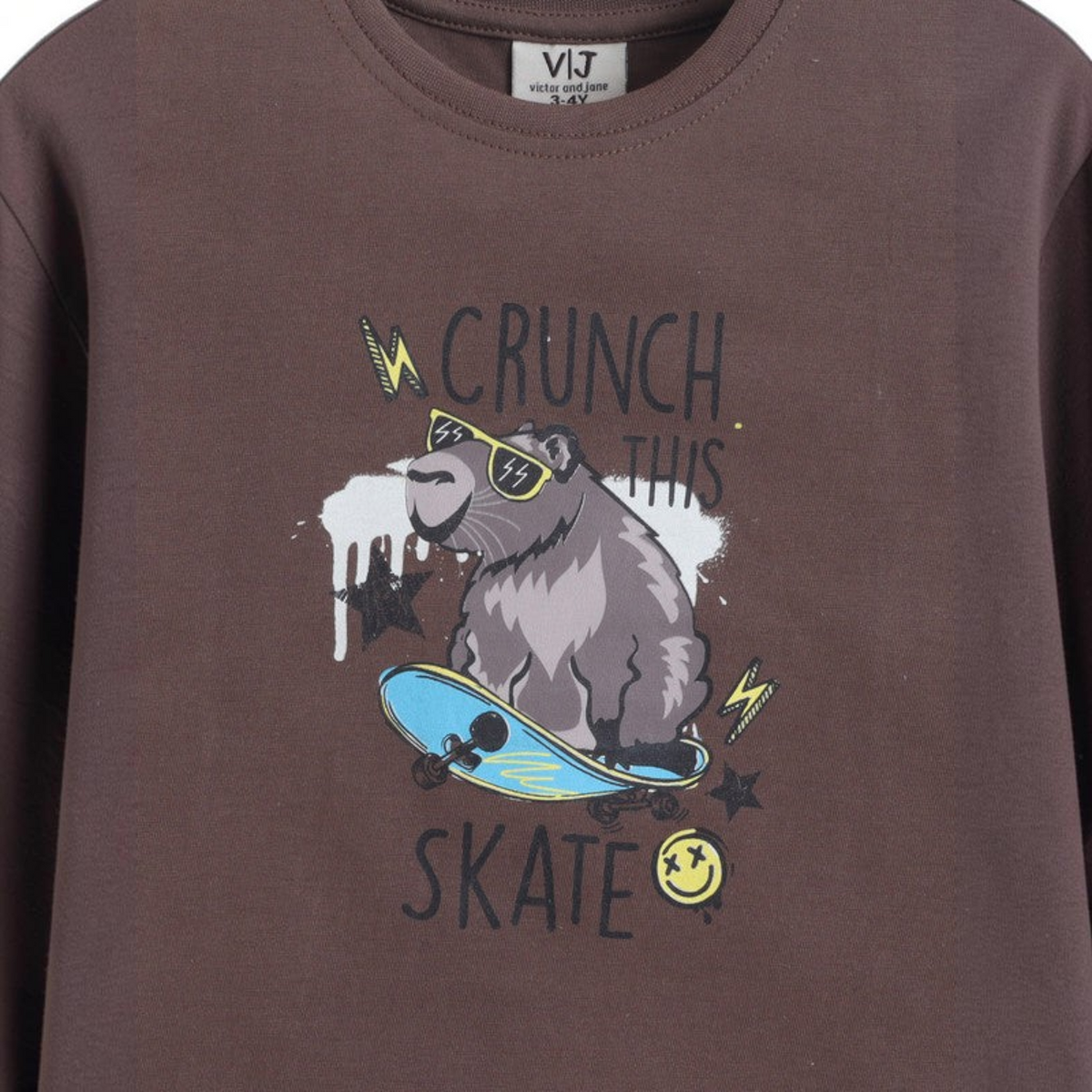 victor and jane boys brown cotton t-shirt featuring a capybara on a skateboard graphic print with text