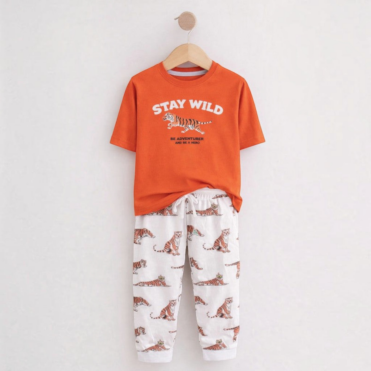 victor and jane boys two-piece pyjama set with orange tiger graphic t-shirt and white tiger print lounge pants