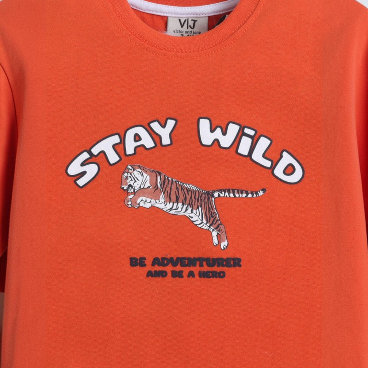 victor and jane boys orange pyjama top with tiger graphic and Stay Wild text