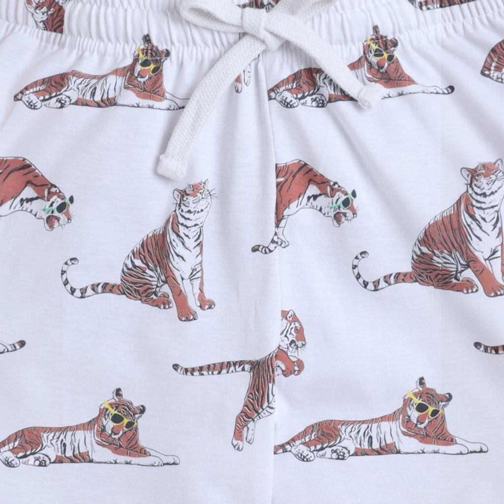victor and jane boys white pyjama set featuring a playful tiger print with tigers wearing colourful sunglasses