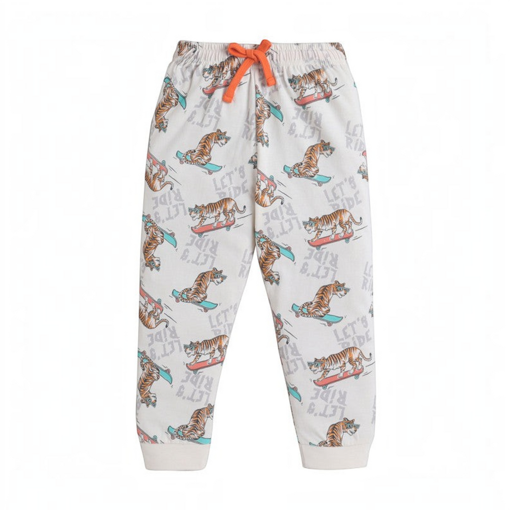 victor and jane boys pyjama bottoms in cream with a tiger on a skateboard print and an orange drawstring waist