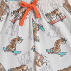 victor and jane boys pyjama bottoms featuring a tiger on a skateboard print with an orange drawstring waist