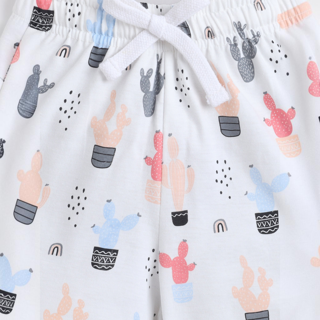 victor and jane girls white shorts featuring a colorful cactus and rainbow print with an adjustable drawstring waist