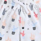 victor and jane girls white shorts featuring a colorful cactus and rainbow print with an adjustable drawstring waist