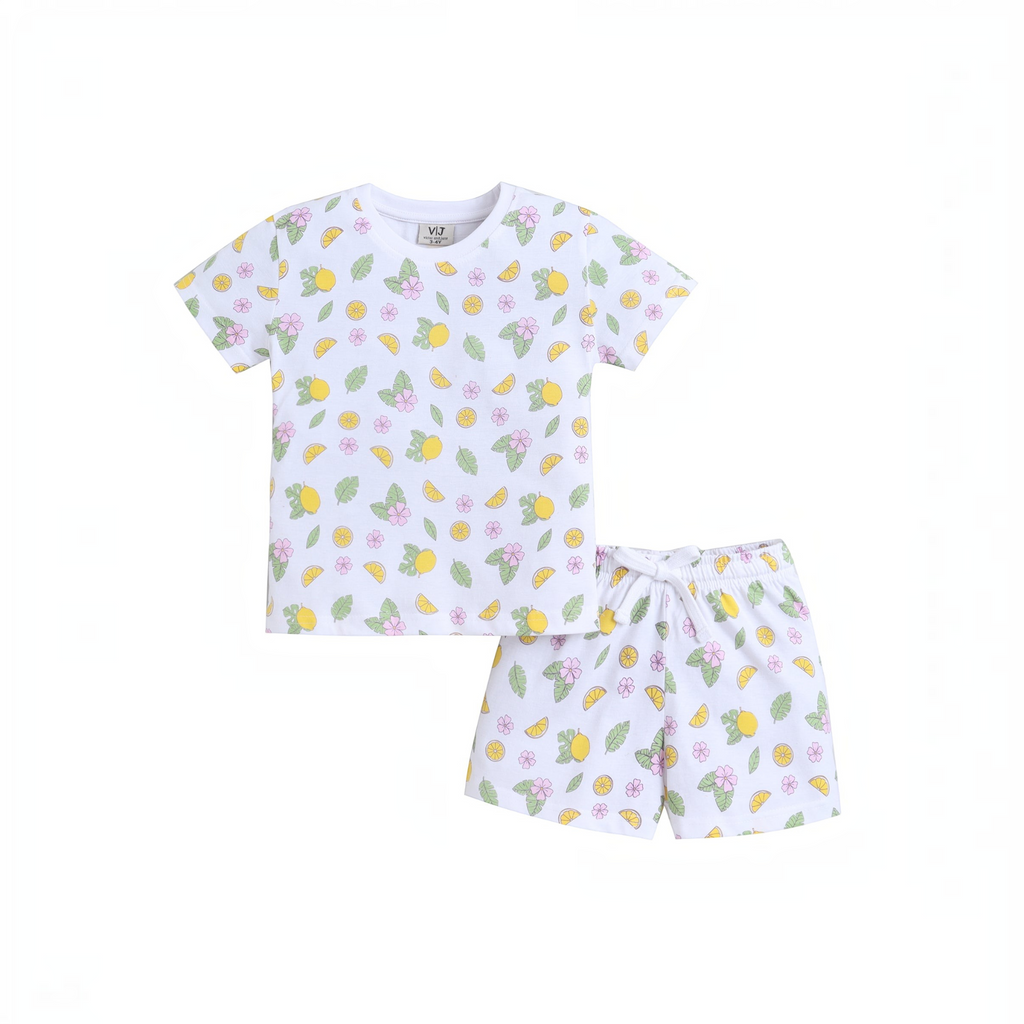 victor and jane girls white t-shirt and shorts set with a colourful lemon, flower, and leaf print pattern