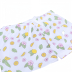 victor and jane girls white shorts featuring a playful lemon, leaf, and pink flower print with an elastic drawstring