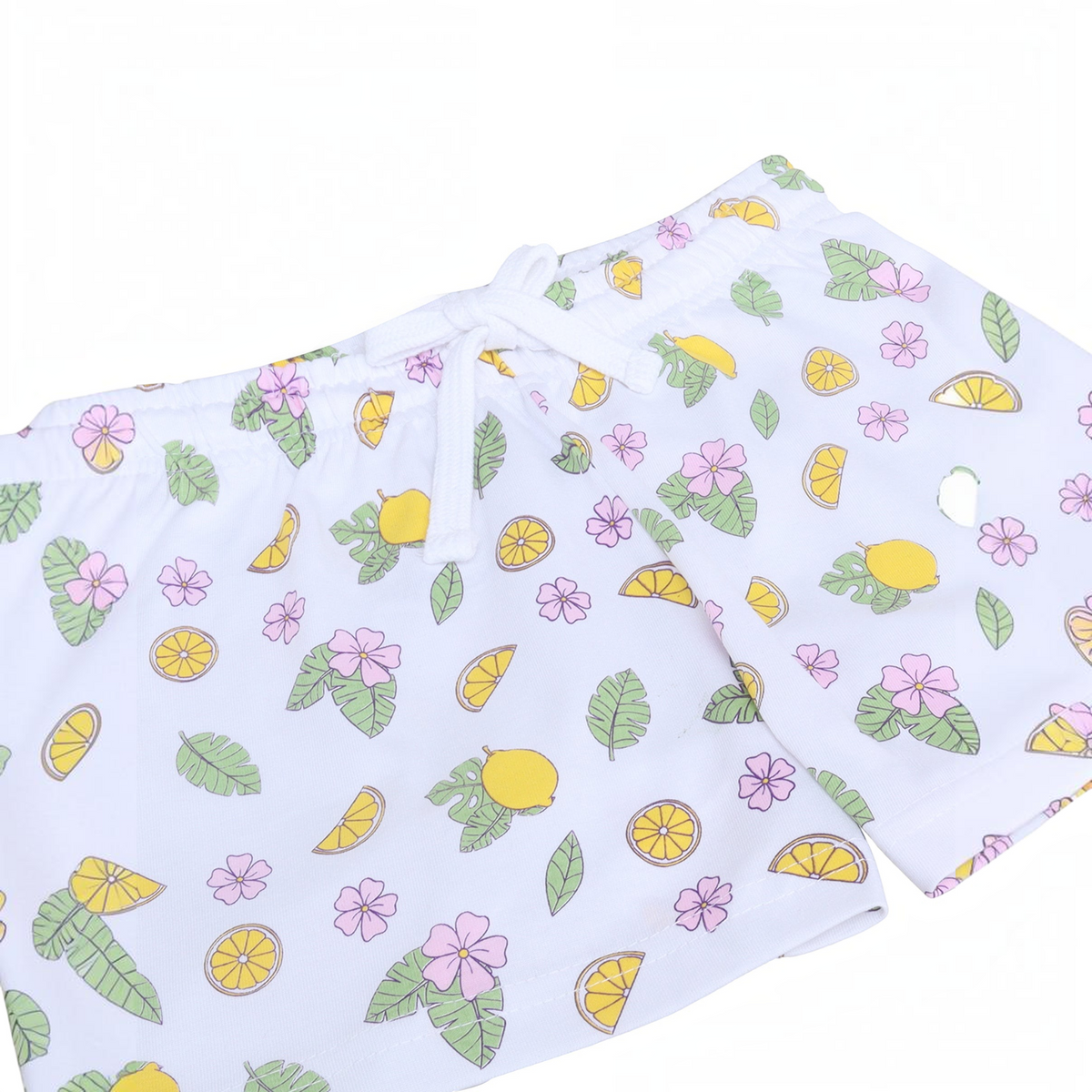 victor and jane girls white shorts featuring a playful lemon, leaf, and pink flower print with an elastic drawstring