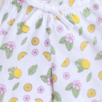 victor and jane girls white shorts featuring a vibrant lemon, tropical leaf, and pink flower print with a drawstring