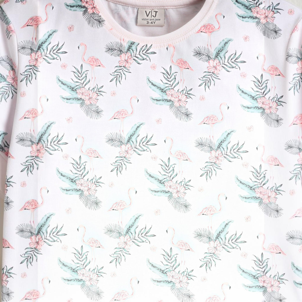 victor and jane girls t-shirt in light pink with a tropical flamingo, flower, and palm leaf print pattern